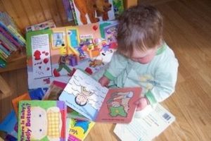 Baby looking at books