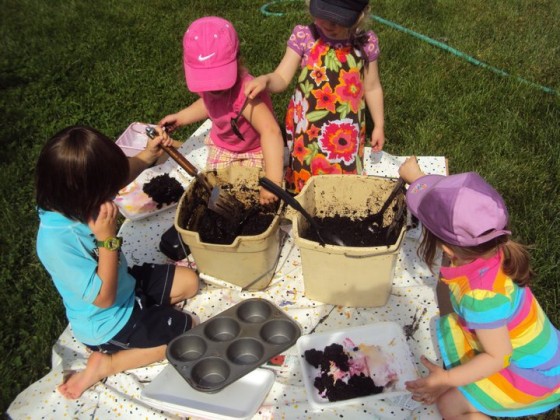 The Happy Hooligans making mud pies