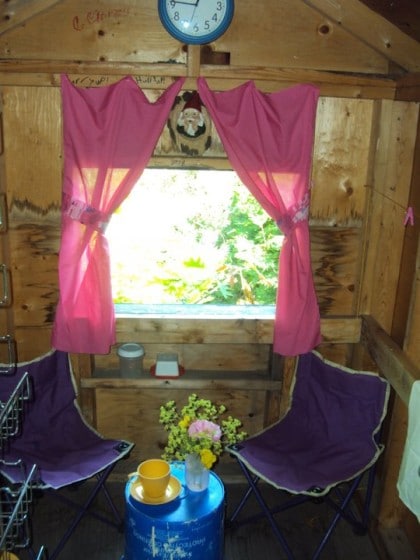 playhouse makeover - curtains and a clock make it cozy