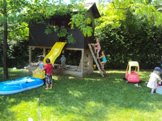 preschoolers climbing ladder to playhouse