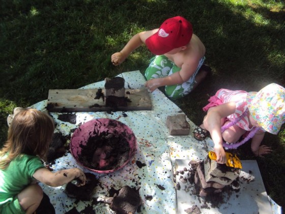 troweling mud on bricks - a mud play idea