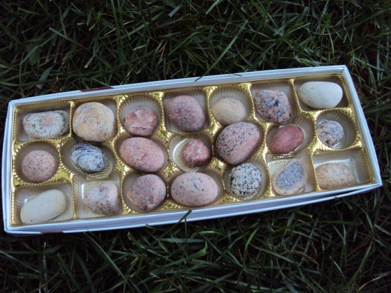 small rocks and stones in box of chocolates 