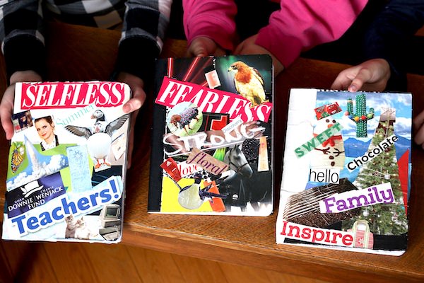 Kids displaying decorated journals
