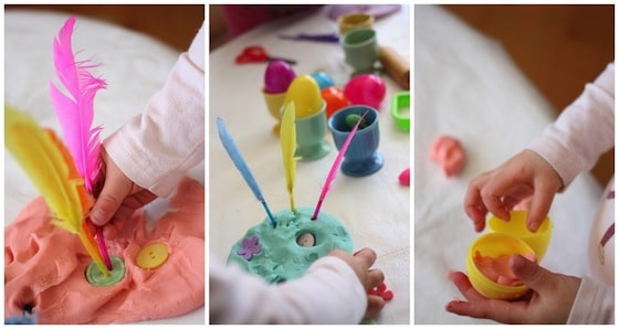 decorating easter playdough with feathers and buttons