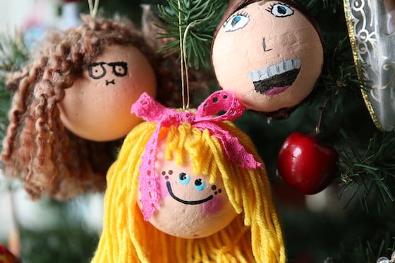 3 ornaments with yarn hair painted to look like little girls