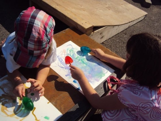 Kids painting with coloured ice