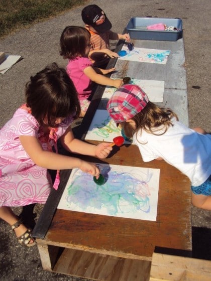 toddlers and preschoolers making art with coloured ice