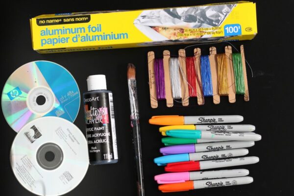 cds, aluminum foil black acrylic craft paint, sharpies, metallic thread