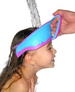 child wearing bath visor in tub