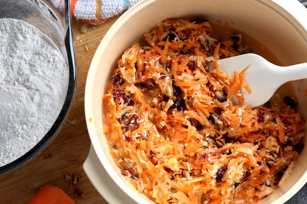 apple, carrot, cranberry, nuts, coconut, in bowl