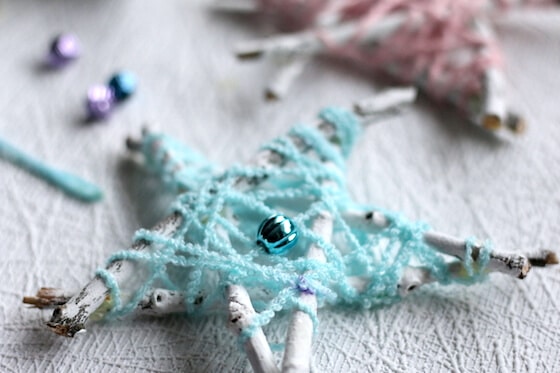 Blue Yarn and white twig ornament made by kids