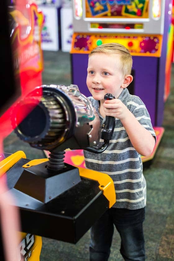 boy playing game at Chuck E. Cheese Birthday party