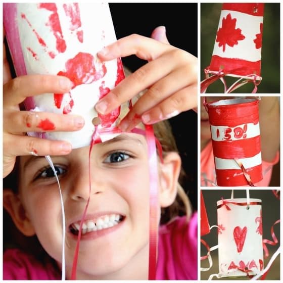 Child holding handprint windsock