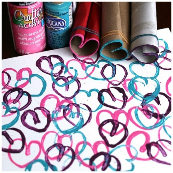 Stamped hearts with cardboard rolls and paint 