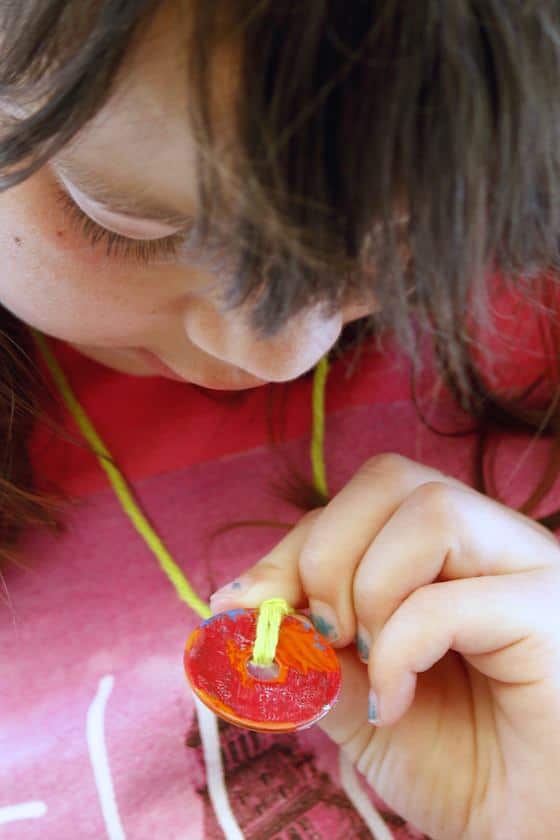 child and red painted washer neclace