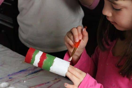 child painting paper towel roll - red green and white strips