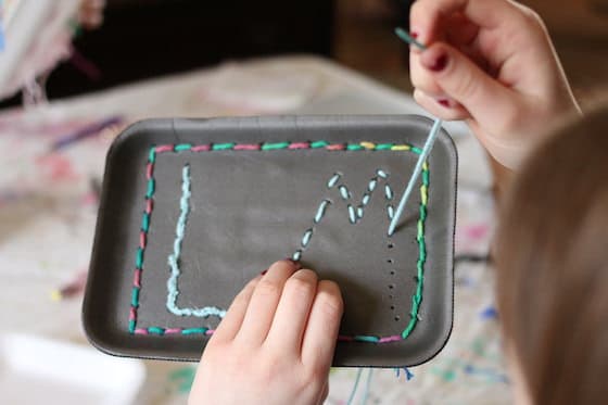 sewing practice - sewing initials on a styrofoam tray
