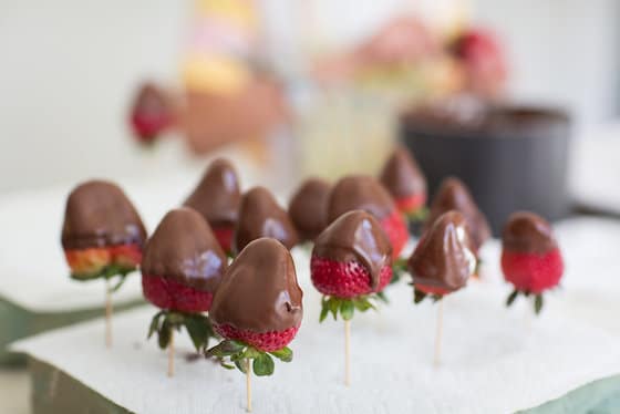 chocolate strawberries on skewers stuck into florists foam