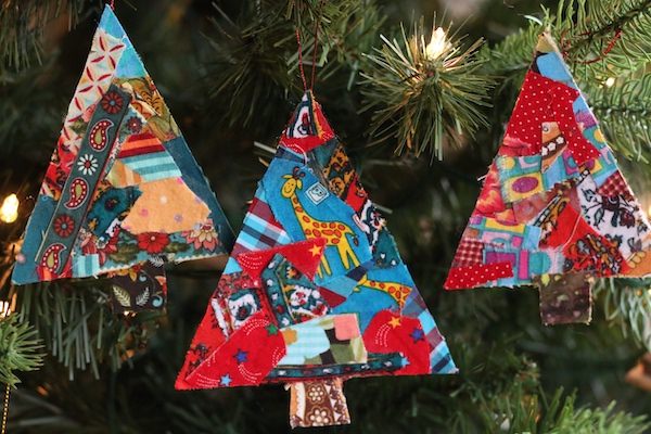 3 tree-shaped Christmas ornaments made out of cardboard and fabric scraps 