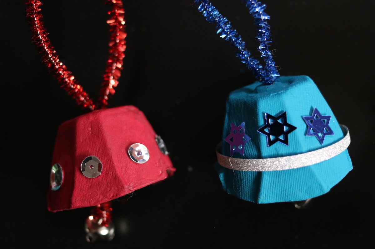 Close up of egg carton bells with pipe cleaner hangers