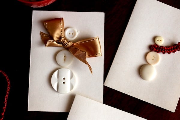 close up button snowman gold bow