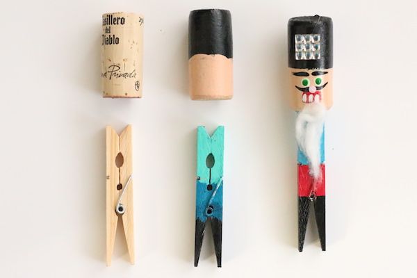 unpainted cork and clothespin beside finished painted nutcracker