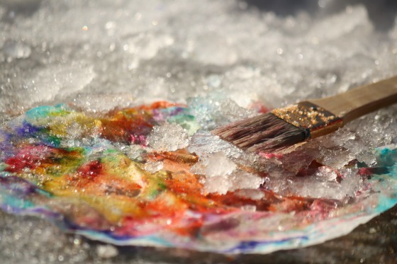 coffee filter and paintbrush covered with snow and marker ink