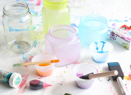 green blue and purple jars painted with glue and food color