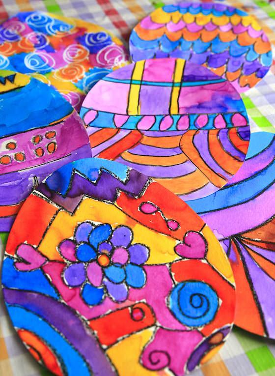 Colourful Easter art for kids with black crayon and liquid watercolours