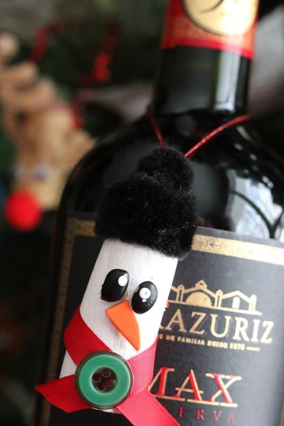 Cork Snowman Ornament hanging around neck of bottle of wine