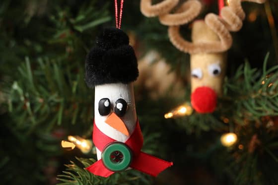 Cork snowman ornament on Christmas tree with cork reindeer ornament in background