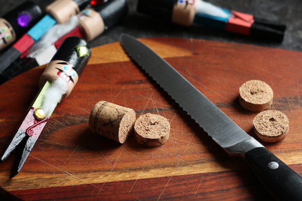 cork cut into disks on wood cutting board