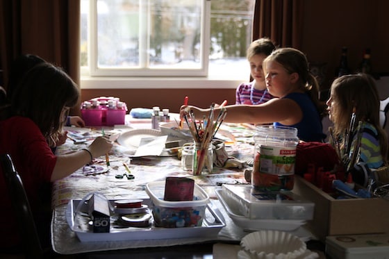 Daycare kids making crafts at dining room table