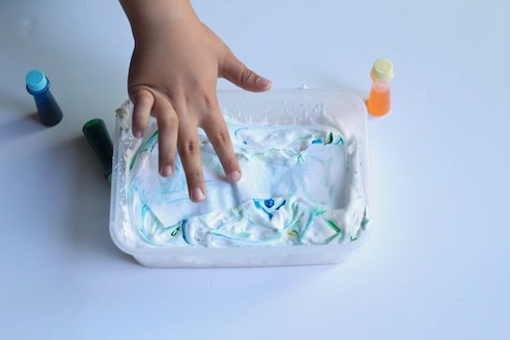 dipping paper tie in shaving cream and food colouring