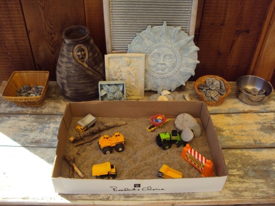 construction vehicle sensory bin in a cardboard box