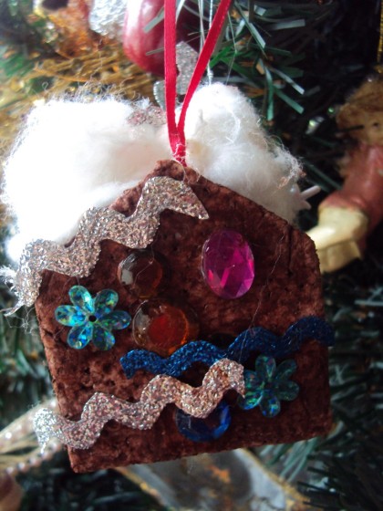 gingerbread house ornament on christmas tree