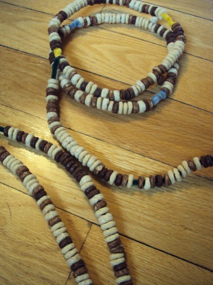 Cheerios threaded on pipe cleaners 