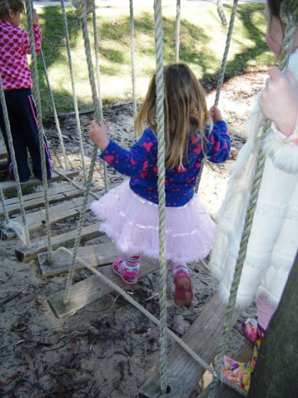 toddlers walking on rickety old bridge - balancing activity