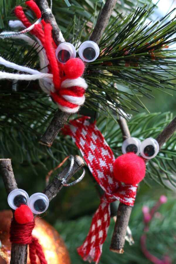 3 twig reindeer with scarves on christmas tree