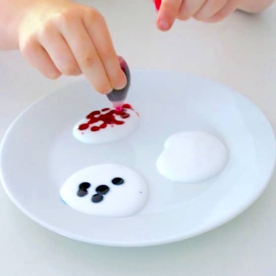 food colouring and white glue on plate