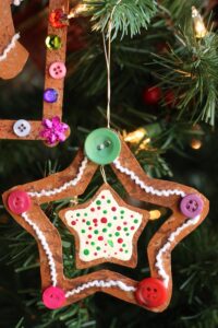 gingerbread star ornament on Christmas tree pin img