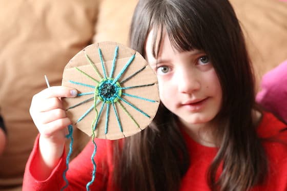 Girl holding circle weaving