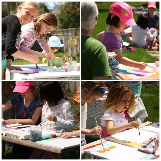 girls painting dollar store canvases at art party