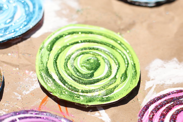 glittered swirls on cardboard lollipop