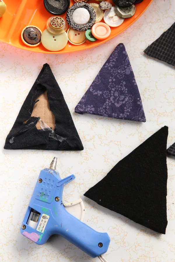 gluing fabric on cardboard witch hats