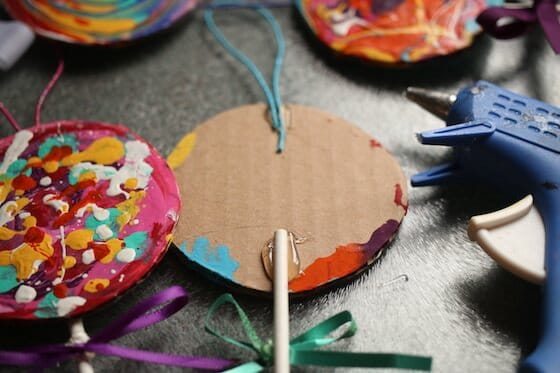 gluing stick to back of cardboard circle