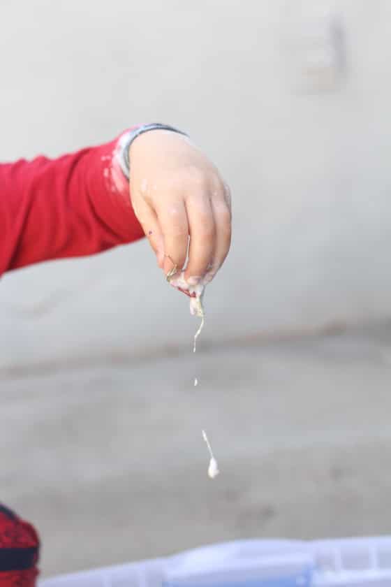 Goop dripping from preschooler's hand