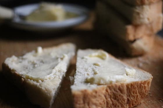 Butter on homemade honey oat bread