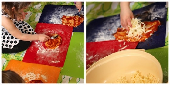 kids putting sauce and cheese on their homemade pizzas