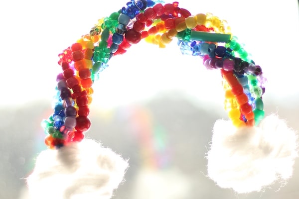 beaded pipe cleaner rainbow hanging in window